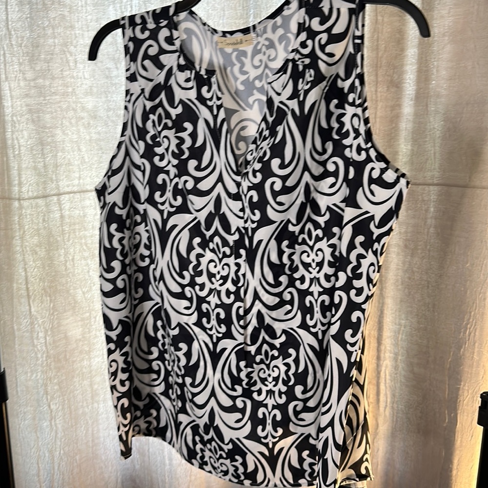 Black and white sleeveless blouse, never worn